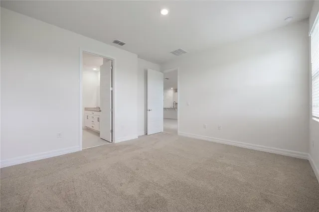 a bathroom with a granite countertop sink mirror and double