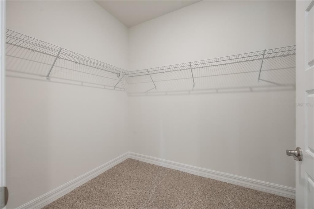 3944 Kennebunk Loop Mount Dora, FL 32757 - Photo 23 of 32 a view of a room with racks on the wall