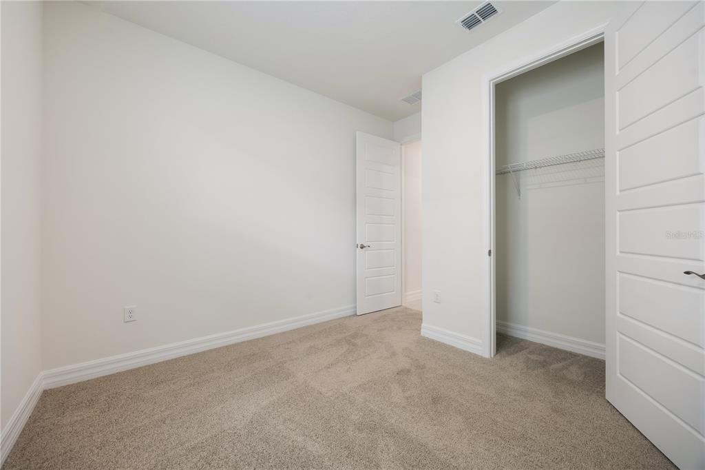 3944 Kennebunk Loop Mount Dora, FL 32757 - Photo 31 of 32 an empty room with closet