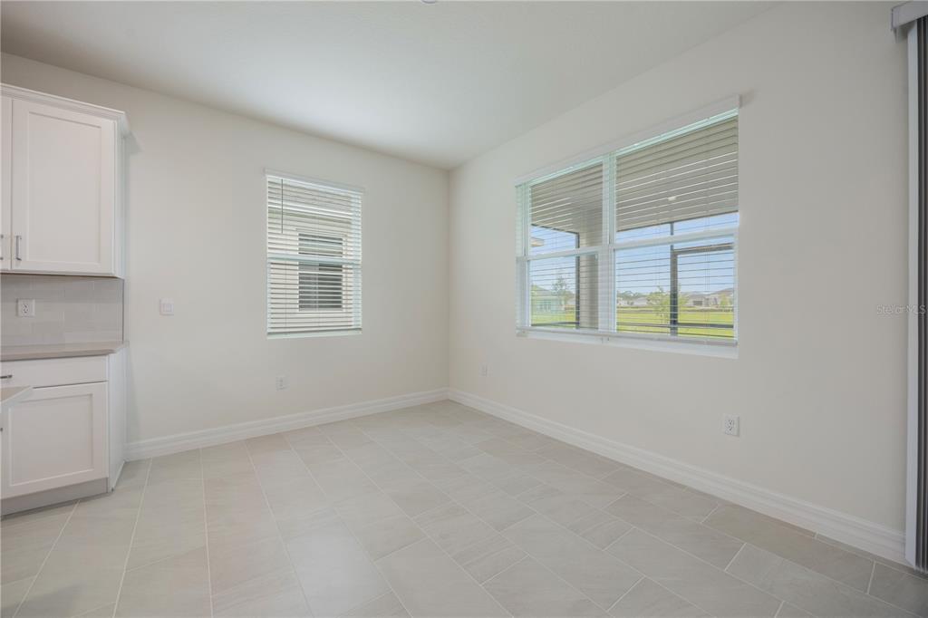 3944 Kennebunk Loop Mount Dora, FL 32757 - Photo 7 of 32 an empty room with windows