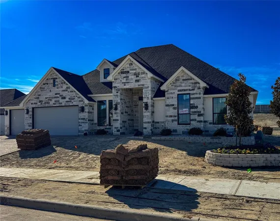 a front view of a house with fire pit