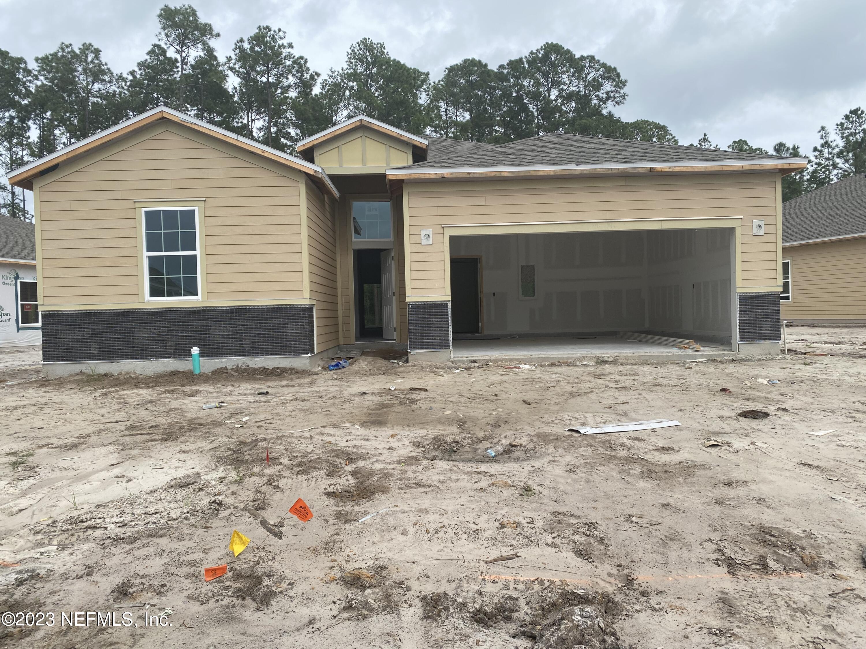 215 White Rabbit Run St. Augustine, FL 32092 - Photo 1 of 1 a front view of a house with a yard