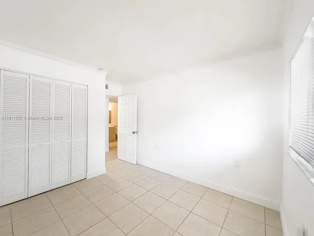 a view of a swimming pool with a patio and a yard