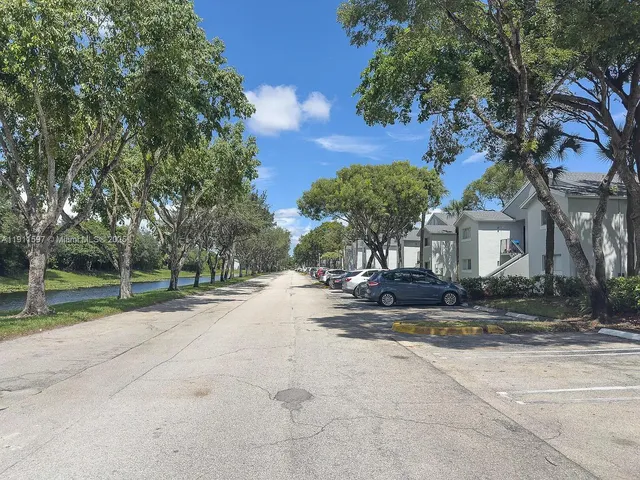 a kitchen with a sink and a stove top oven