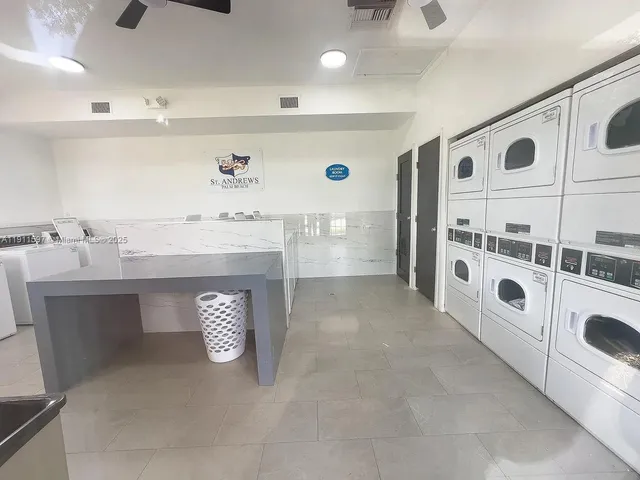 a room with lots of furniture and windows