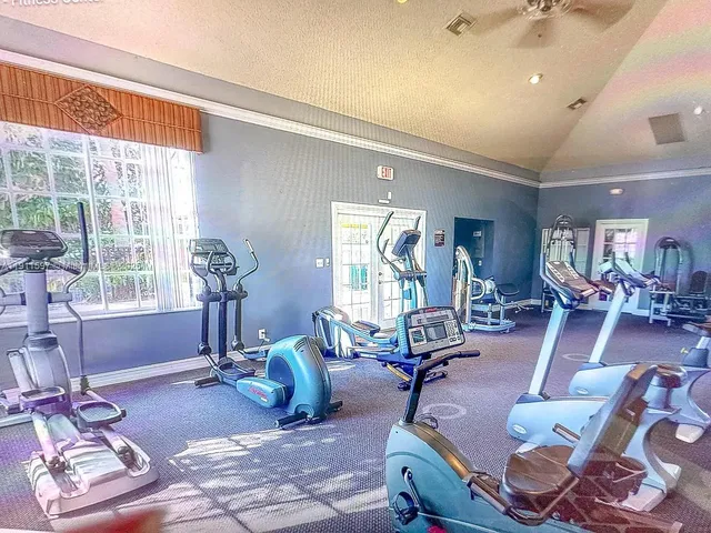 a house with a yard and a large tree