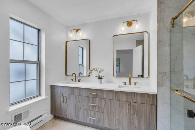 11 Sedgwick Square Jackson, NJ 08527 - Photo 13 of 19 a bathroom with a double vanity sink and mirror