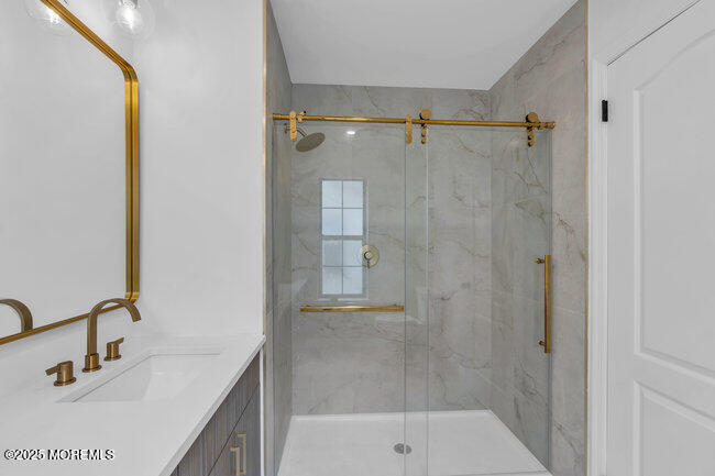 11 Sedgwick Square Jackson, NJ 08527 - Photo 14 of 19 a bathroom with a shower and a sink