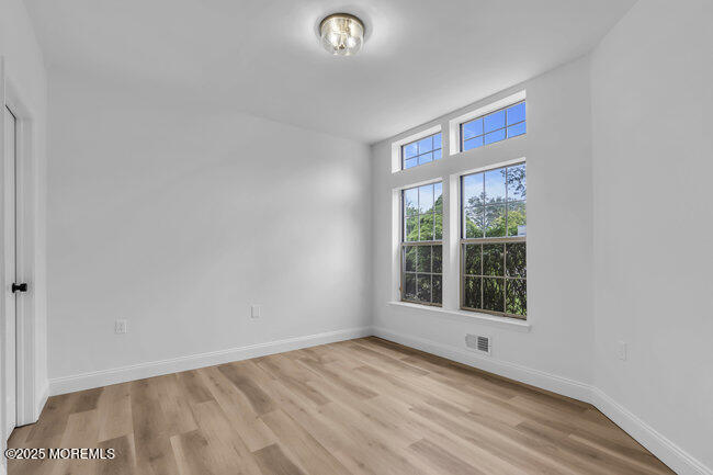 11 Sedgwick Square Jackson, NJ 08527 - Photo 15 of 19 a view of a livingroom with wooden floor and window