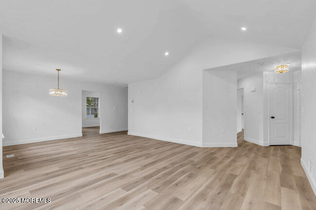 11 Sedgwick Square Jackson, NJ 08527 - Photo 5 of 19 a view of an empty room with wooden floor and a window