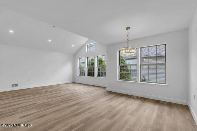 11 Sedgwick Square Jackson, NJ 08527 - Photo 6 of 19 an empty room with wooden floor and windows