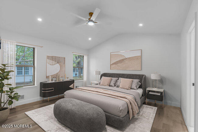 11 Sedgwick Square Jackson, NJ 08527 - Photo 10 of 19 a bedroom with a large bed and a chandelier