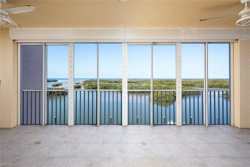 435 Dockside Drive, Unit B703 Naples, FL 34110 - Photo 7 of 38 a view of an empty room with a balcony