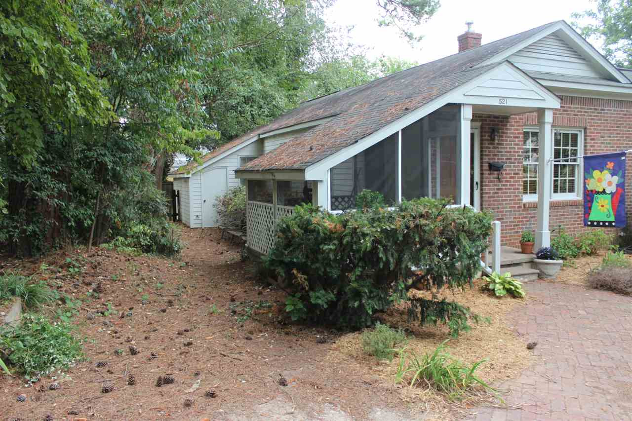 521 Mills Street Raleigh, NC 27608 - Photo 13 of 16 SIDE OF SCREENED-IN PORCH