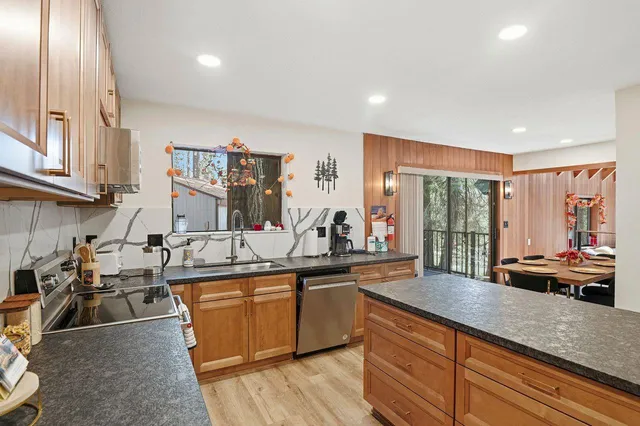 a kitchen with lots of counter top space and living room