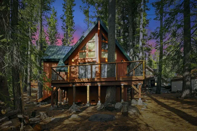 a view of a house with large windows