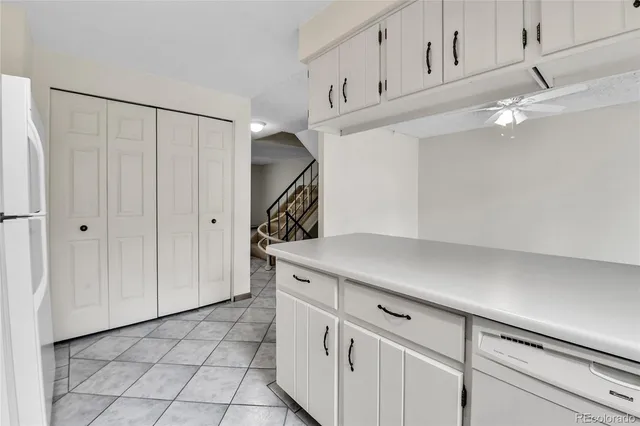 a kitchen with cabinets a sink and dishwasher