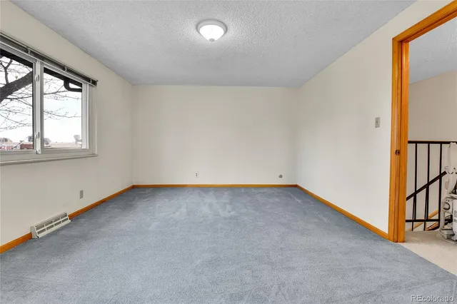 a bathroom with a sink a mirror a vanity and a shower