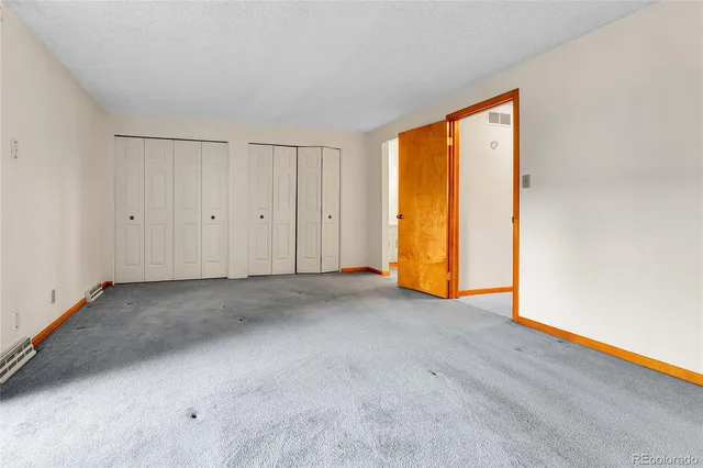 a view of empty room with floor to ceiling window