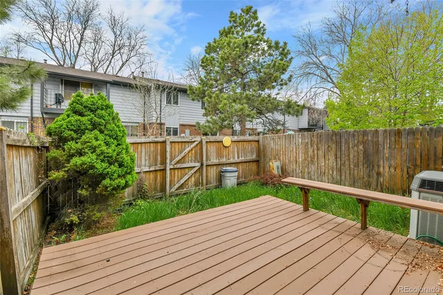 a view of a balcony with wooden floor