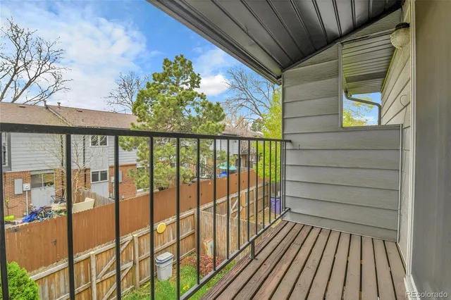 a view of balcony with wooden floor