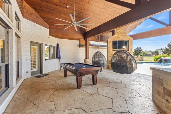 a swimming pool with a outdoor seating