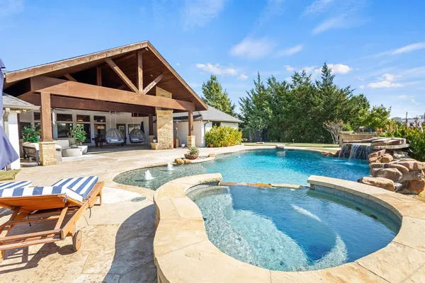 a view of a house with swimming pool