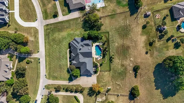 an aerial view of a residential apartment building with a yard