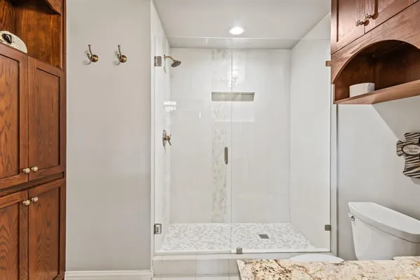 a bathroom with a shower curtain and a window