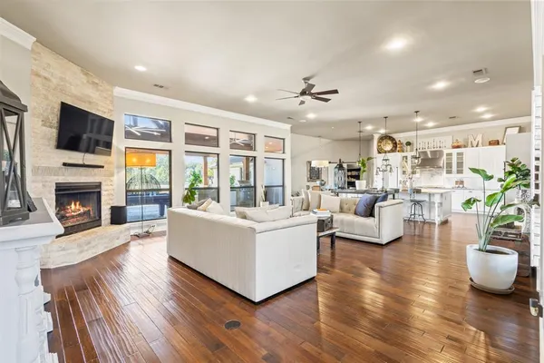 a living room with furniture fireplace and flat screen tv