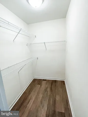 a bathroom with a double vanity sink mirror and toilet