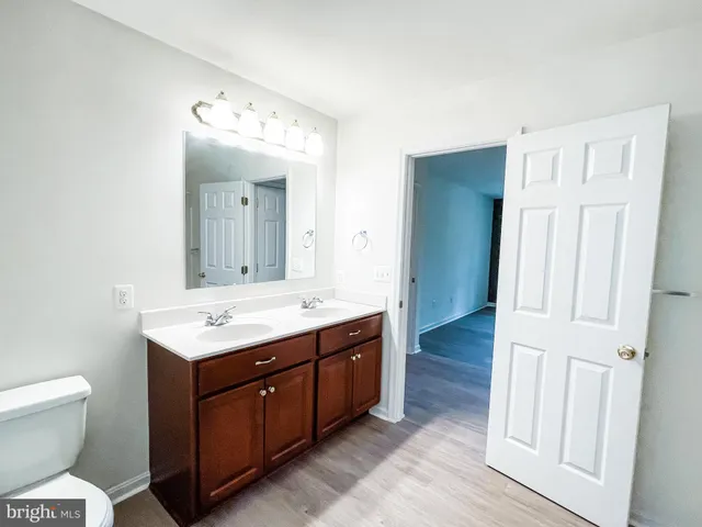 a bathroom with a tub shower and sink