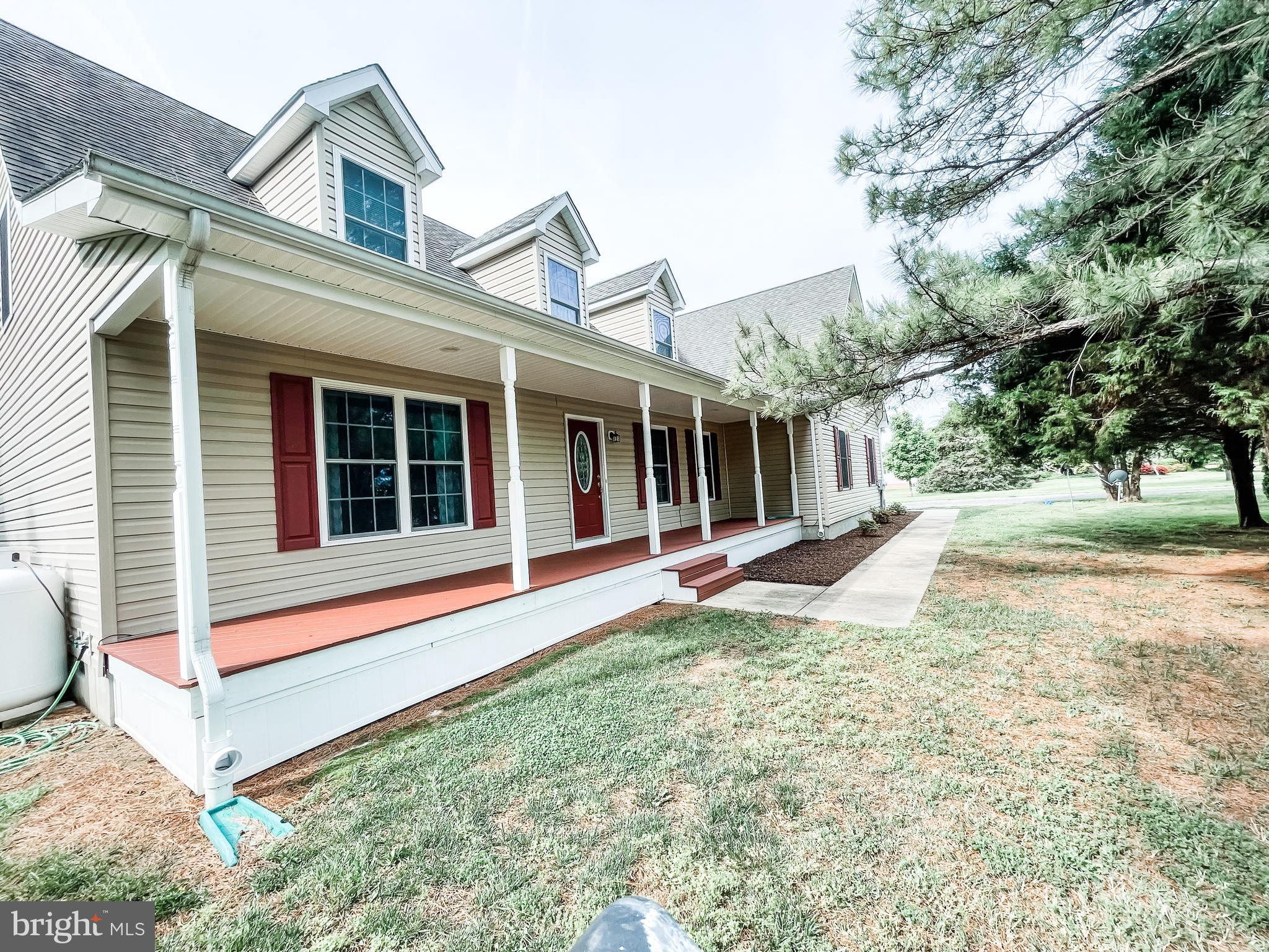 18162 White Tail Way St. Inigoes, MD 20684 - Photo 2 of 29 a view of a house with a large window and a yard