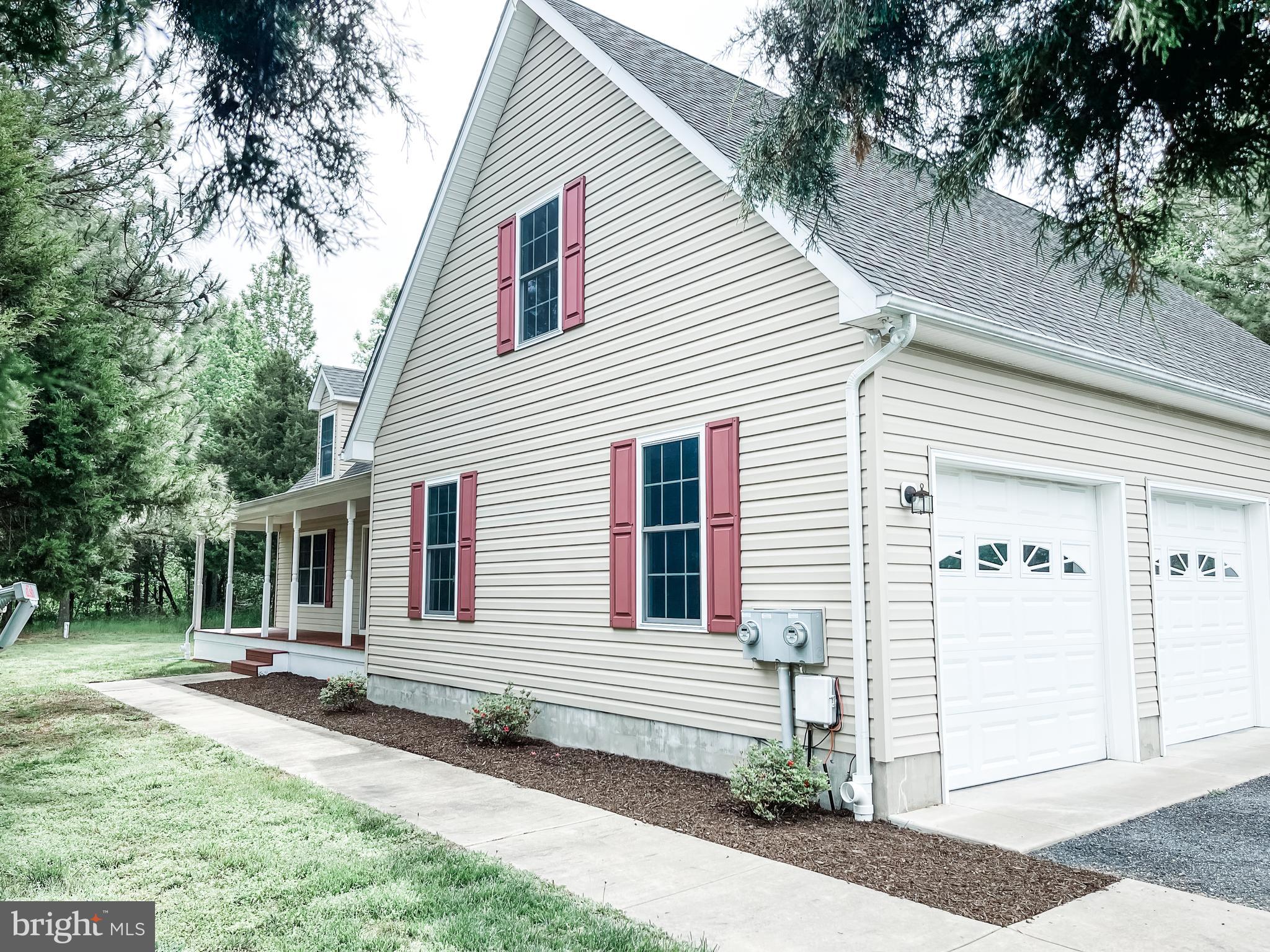 18162 White Tail Way St. Inigoes, MD 20684 - Photo 3 of 29 a view of a house with a yard