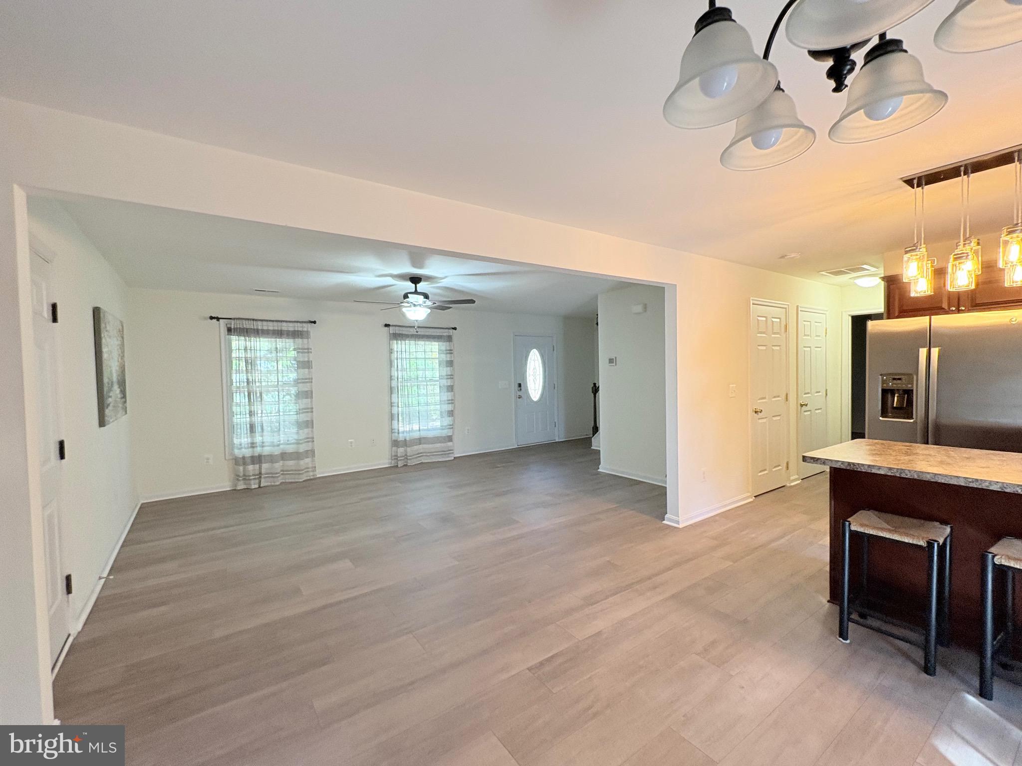18162 White Tail Way St. Inigoes, MD 20684 - Photo 6 of 29 a view of a livingroom with a fireplace and furniture