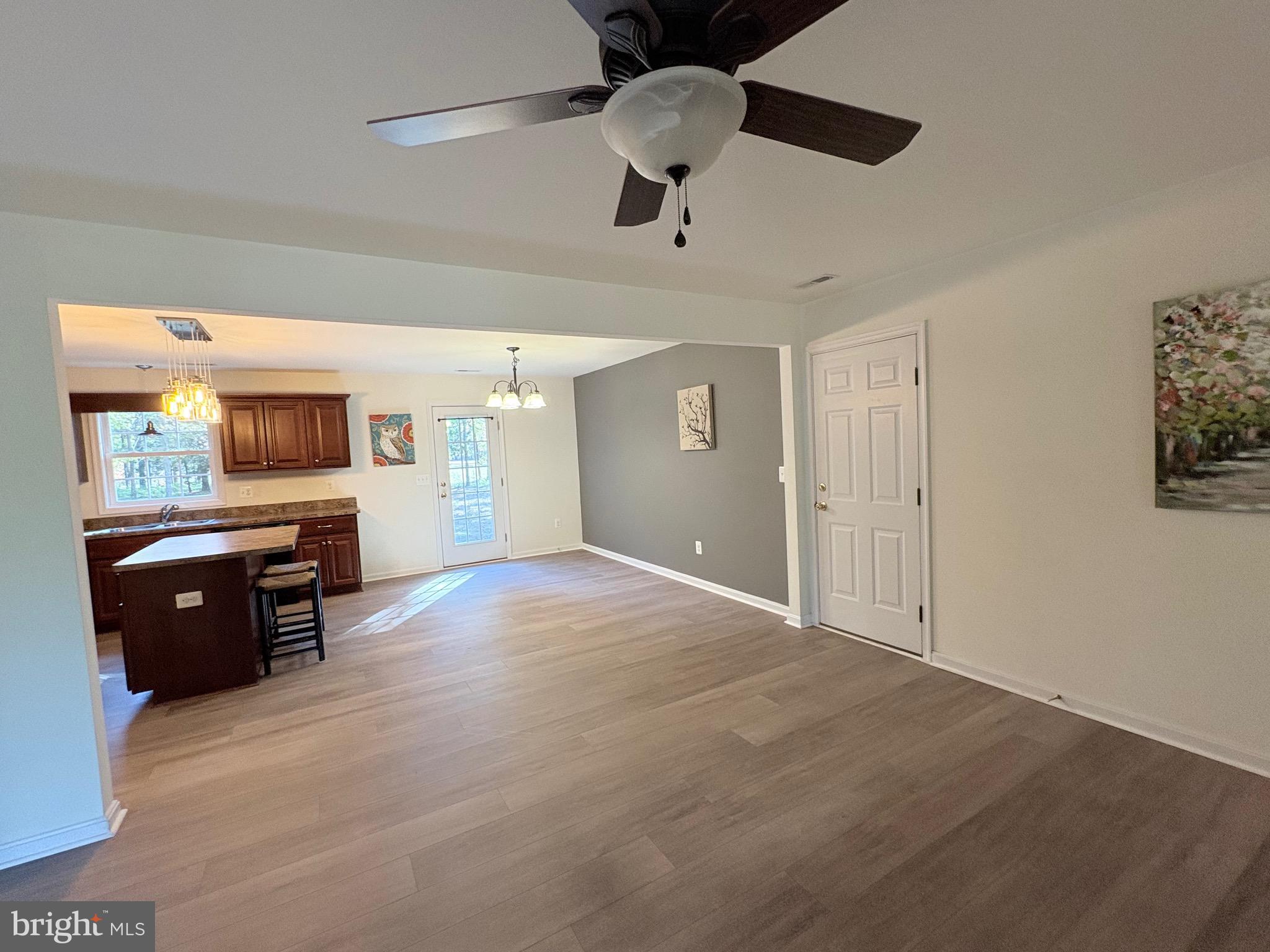 18162 White Tail Way St. Inigoes, MD 20684 - Photo 8 of 29 a view of a livingroom with furniture window and wooden floor