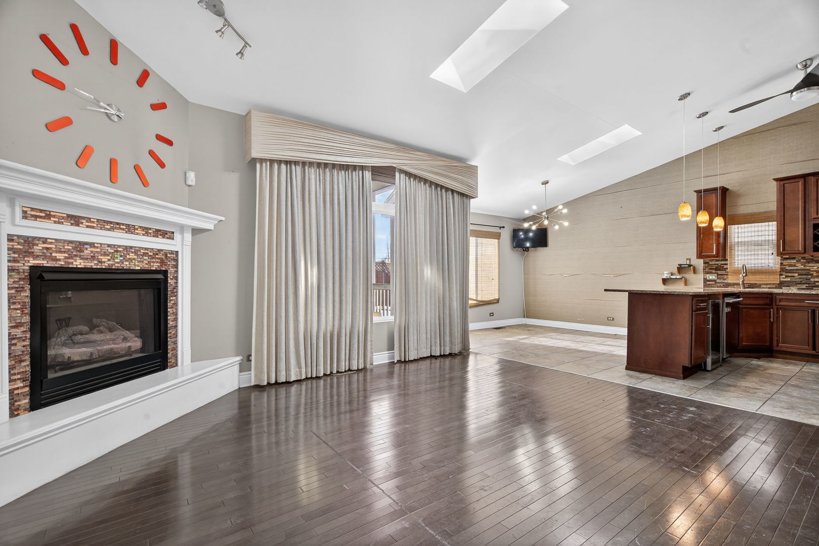 3015 140th Place Blue Island, IL 60406 - Photo 2 of 22 a view of a kitchen with a fireplace wooden floor and a window