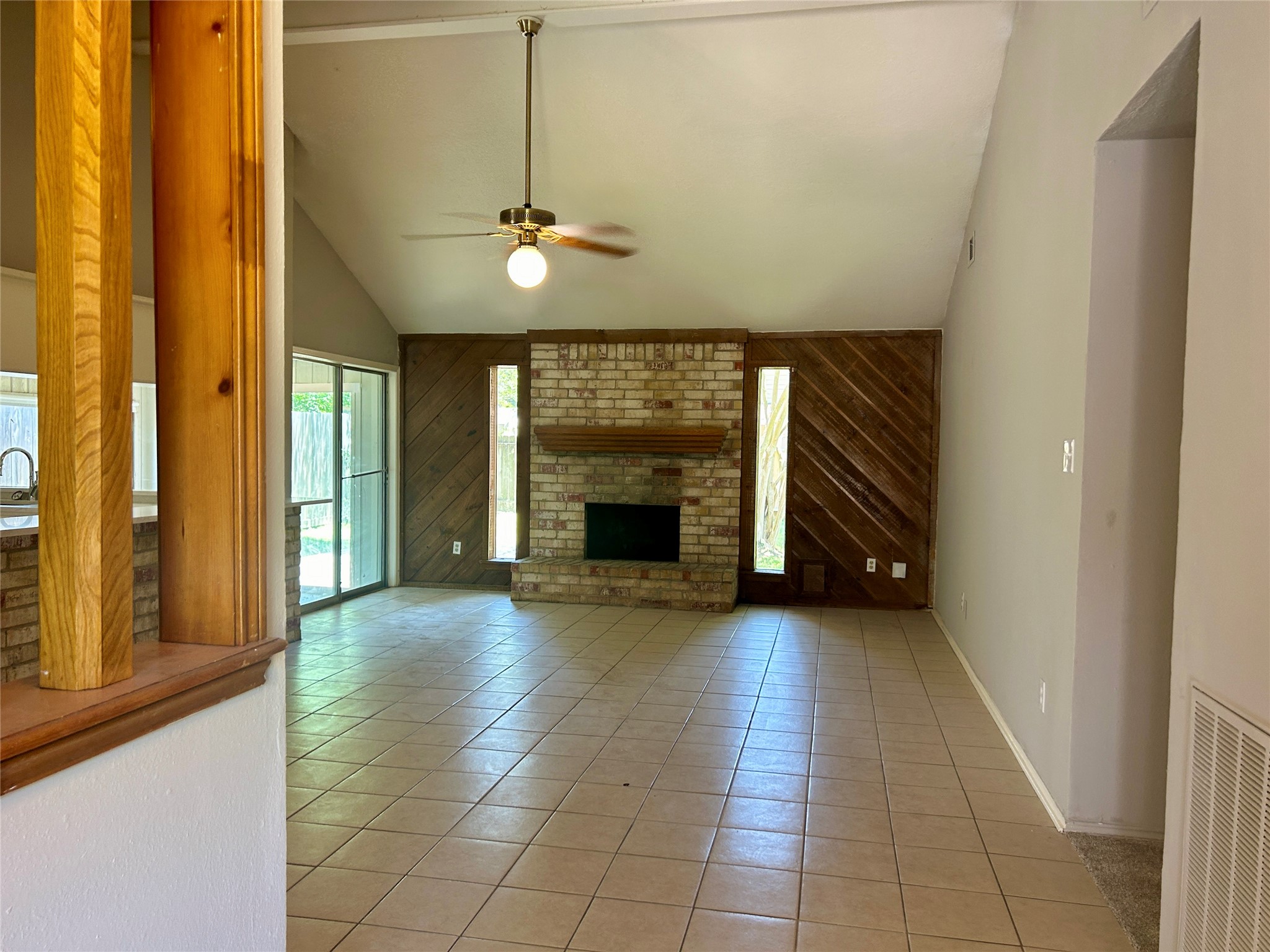 2510 Knollbrook Lane Spring, TX 77373 - Photo 6 of 24 a view of an empty room with a fireplace and a window
