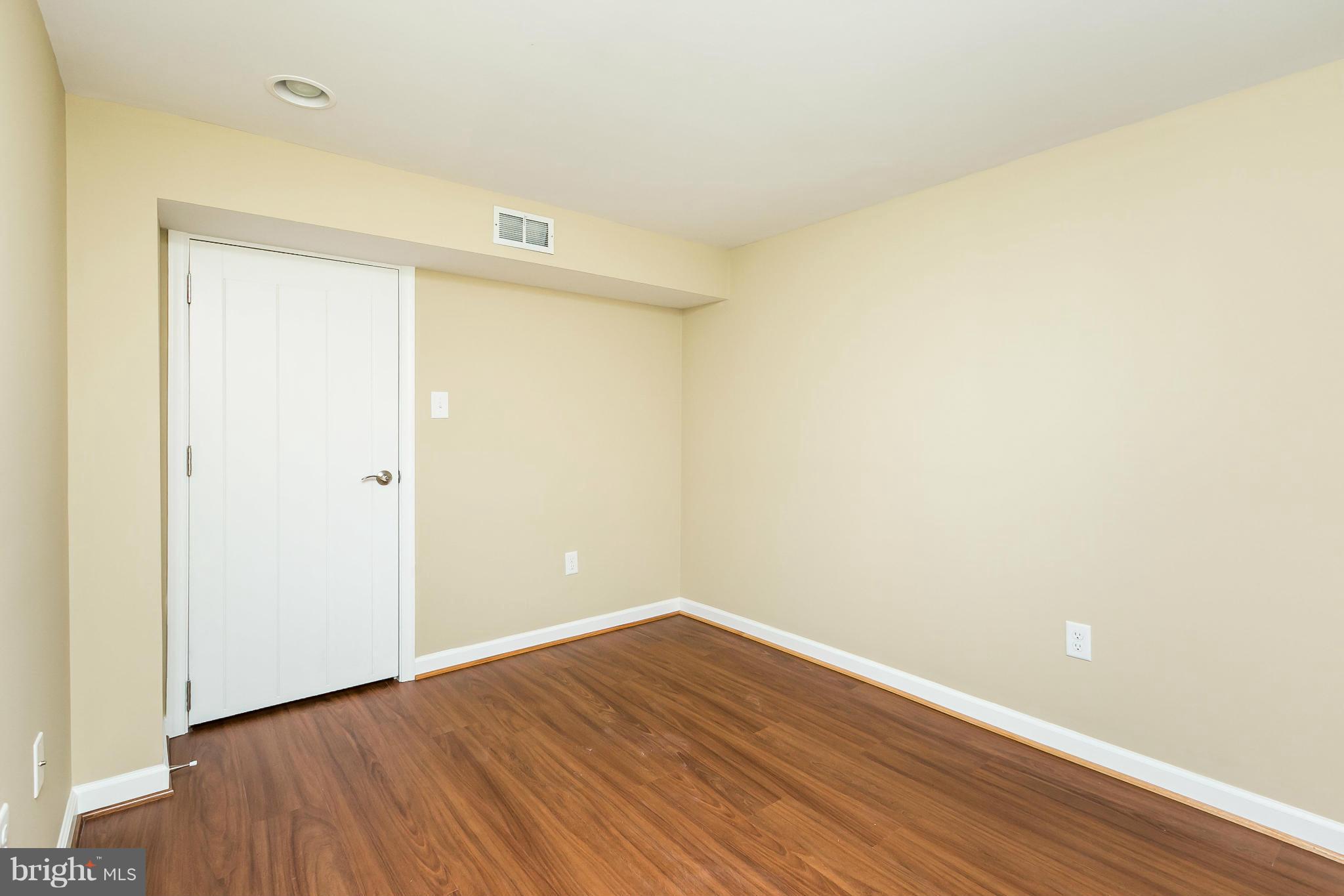 6727 Fordcrest Road Baltimore, MD 21237 - Photo 22 of 29 a view of an empty room with wooden floor