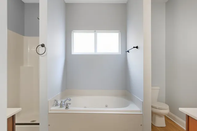 wooden floor in an empty room and a window