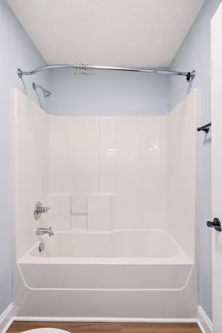 an empty room with fan and a ceiling fan