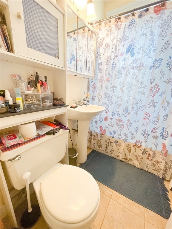 12 Ransom Road, Unit 6 Boston, MA 02135 - Photo 12 of 16 a bathroom with a sink toilet and shower