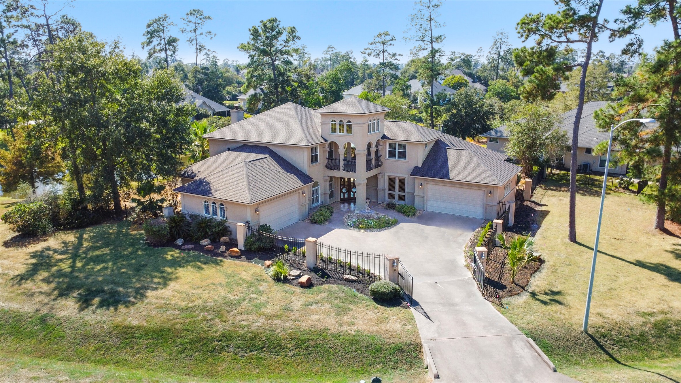 a view of a house with wooden fence