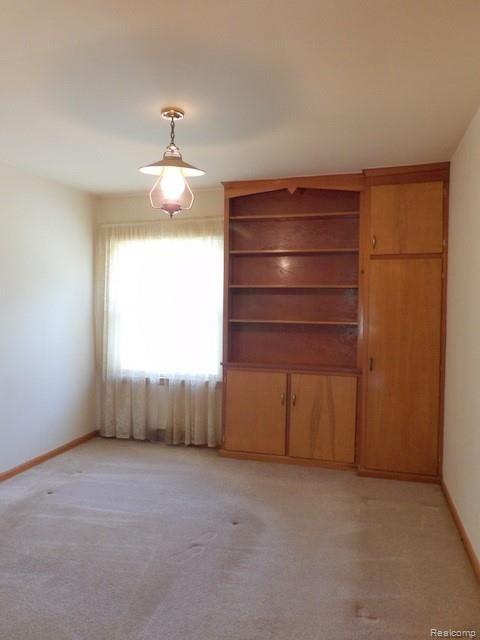 9681 Allen Road Allen Park, MI 48101 - Photo 43 of 65 42. BEDROOM #1 FEATURES A BUILT-IN BOOKSHELF + CABINETS!