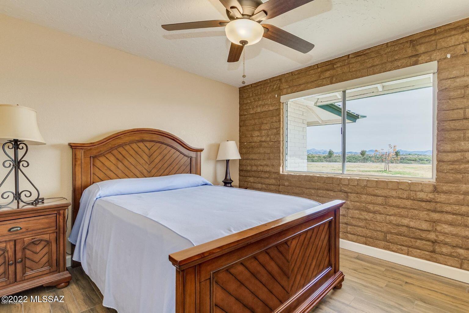 36645 South Arivaca Ranch Road Arivaca, AZ 85601 - Photo 20 of 49 a bedroom with a bed and window