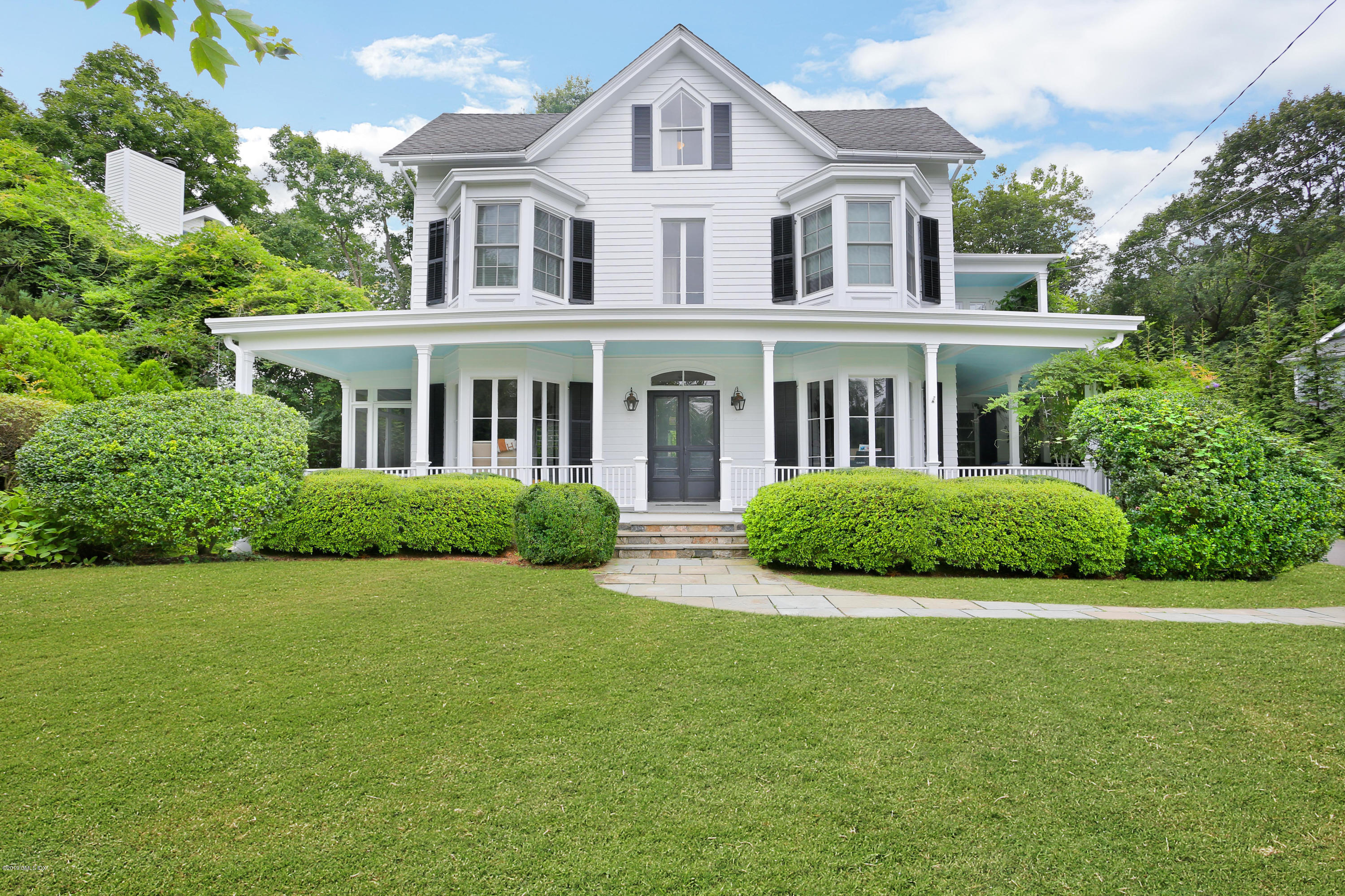 20 Lockwood Road Riverside, CT 06878 - Photo 1 of 27 a front view of a house with yard and green space