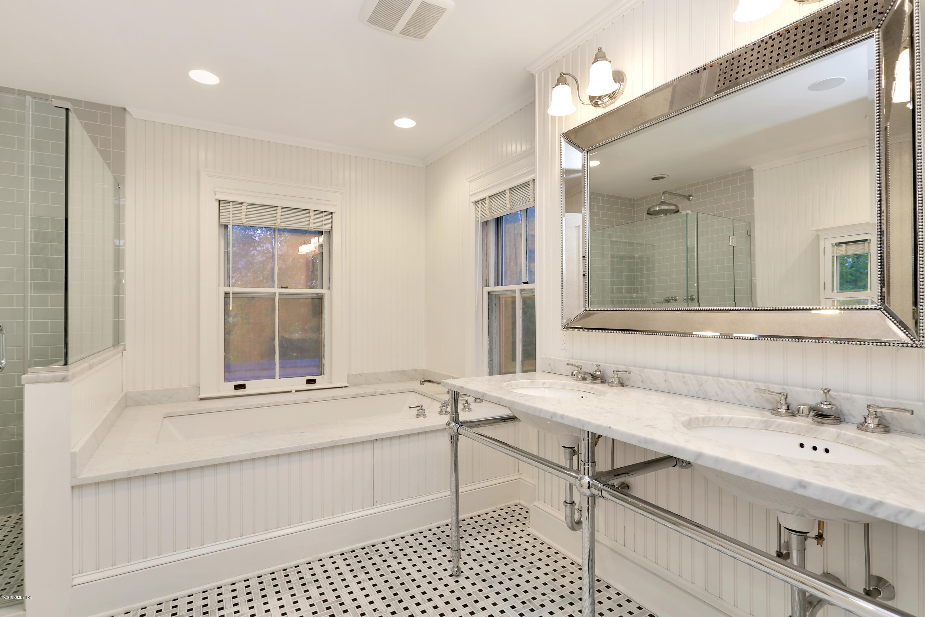 20 Lockwood Road Riverside, CT 06878 - Photo 17 of 27 a bathroom with a sink and a mirror