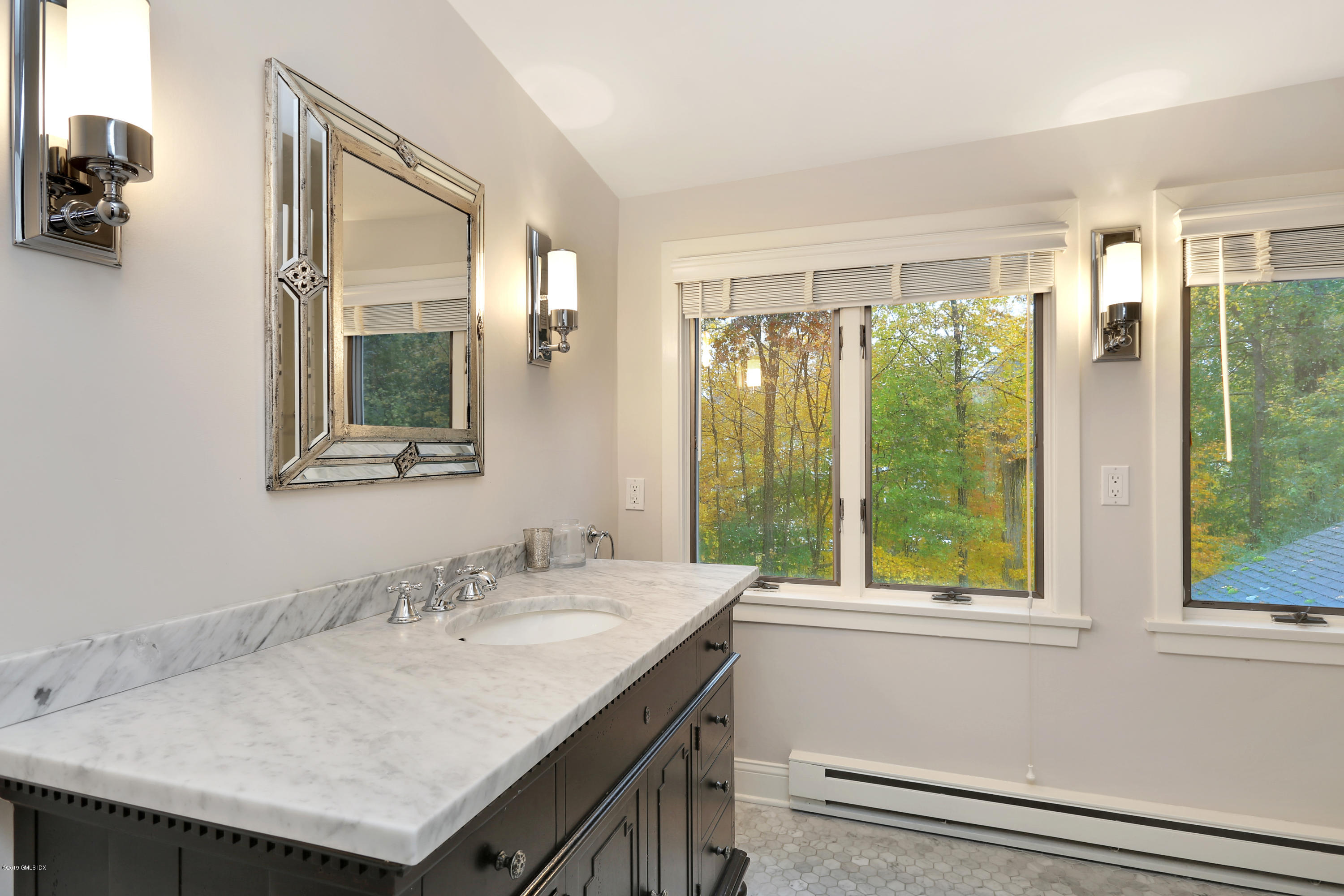 20 Lockwood Road Riverside, CT 06878 - Photo 20 of 27 a bathroom with a granite countertop sink and a window