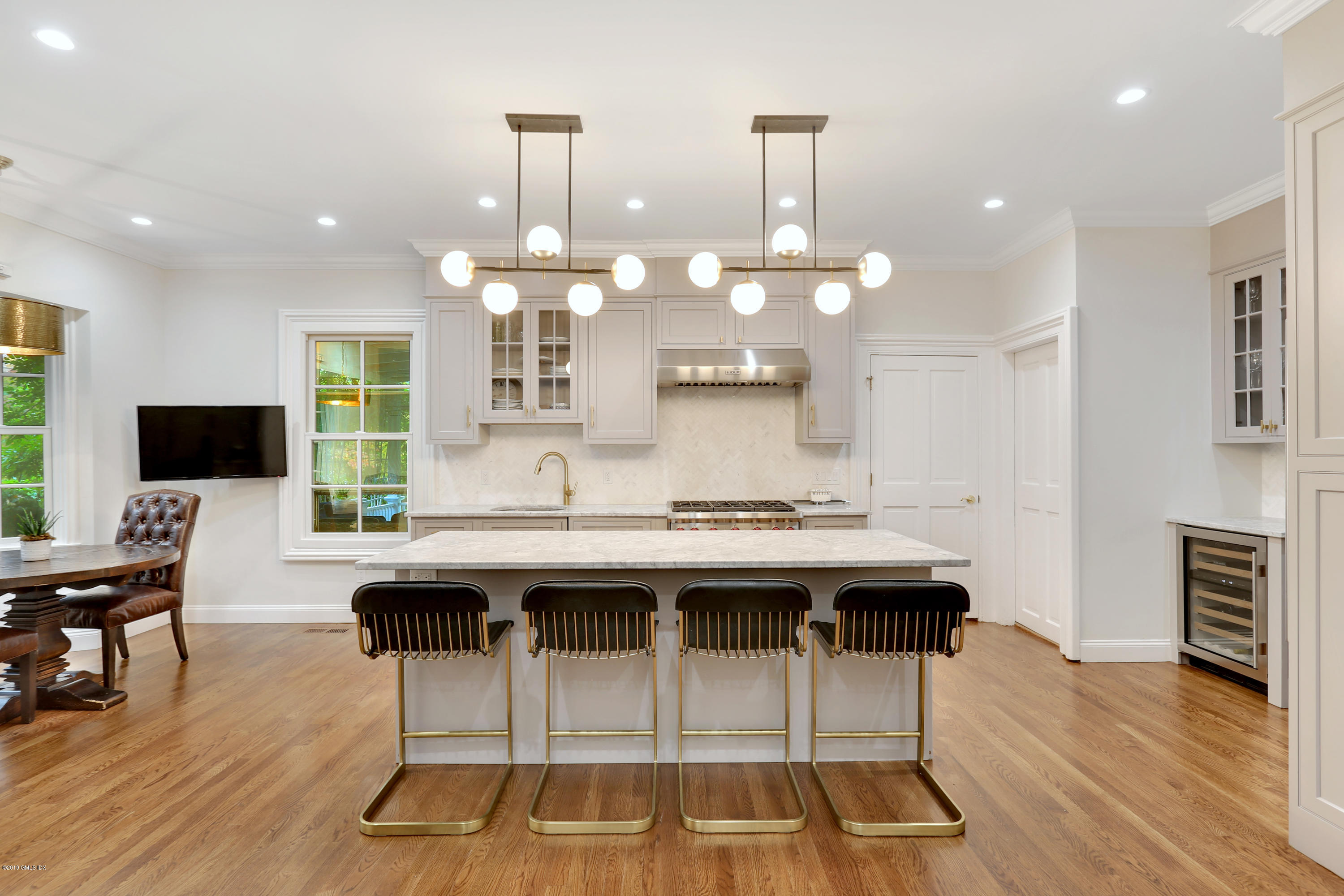 20 Lockwood Road Riverside, CT 06878 - Photo 6 of 27 a kitchen with a sink and chairs