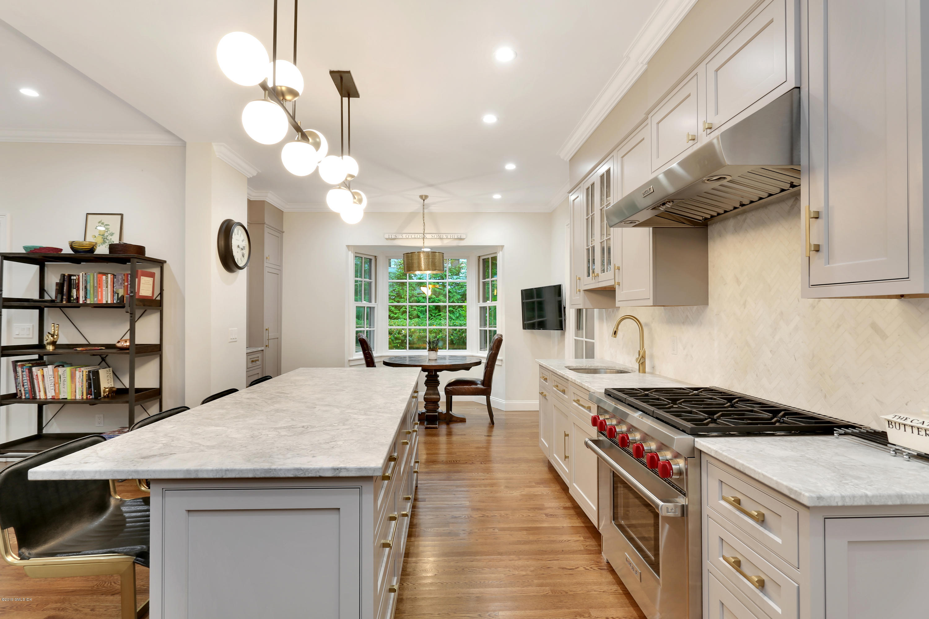 20 Lockwood Road Riverside, CT 06878 - Photo 7 of 27 a kitchen with a stove cabinets and wooden floor